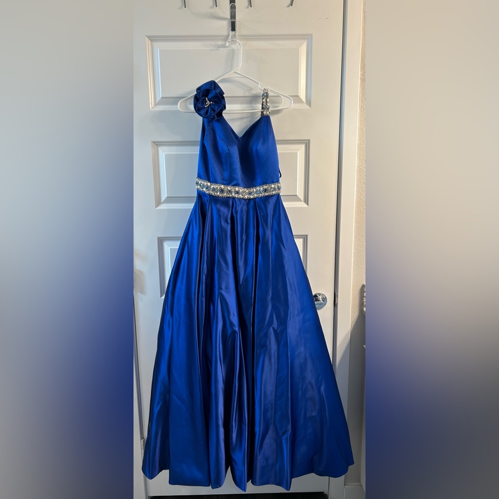 Blue custom made ball gown with rose detailing on the shoulder and gem detailing